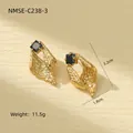 Detailed view of irregular gold earrings with black gemstone, 3.2cm height and 1.8cm width - Black Zirconia Conch Style (NMSE-C238-3) / 18K Gold / Gold