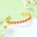 Bracelet jononc marguerites dorées avec émail rouge sur fond vert frais printanier - Bracelet fleur rose