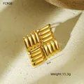 Detailed macro view of 18K gold titanium steel square earrings with ribbed texture design - Square Striped Ring (NMSR-G1410-1) / Gold