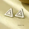 Macro view of silver geometric triangle earrings showing dimensions 2.8cm and 9.2g weight - Triangle Steel Color