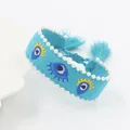 Blauwe geweven Evil Eye armband met witte parels en handgemaakte kwastjes voor dames - Hemelsblauw