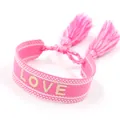 Pink woven friendship bracelet with LOVE embroidery and adjustable tassels on white background - Pink LOVE