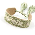 Handwoven friendship bracelet with green and white happiness embroidery and tassels - Happiness
