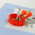 Orange woven friendship bracelet with LOVE embroidery and decorative tassels - LOVE Letter / Fluorescent Red