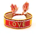 Red and yellow bohemian woven friendship bracelet with LOVE embroidery and tassel detail - Gold Thread LOVE