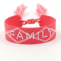 Pink woven friendship bracelet featuring FAMILY text and adjustable tassels - Silver FAMILY Style