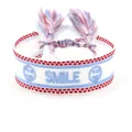 White woven bracelet featuring blue SMILE embroidery and adjustable tassels - Smiley Face SMILE