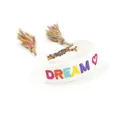 Woven friendship bracelet featuring rainbow DREAM embroidery and red heart detail - DREAM