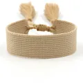 Macro detail of beige woven ethnic bracelet featuring adjustable drawstring and tassels - Khaki (B015)