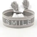 Gray and beige woven bracelet with SMILE lettering and adjustable tassels - Silver Smile Style