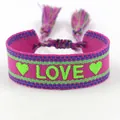 Handwoven bright pink friendship bracelet with green LOVE text pattern and colorful tassels - L008 LOVE / Pink Multicolor