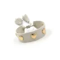 Detail of grey woven friendship bracelet featuring gold heart studs and fringe tassels - Gold Heart Rivets / Grey Beige (H008)