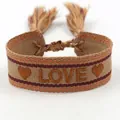 Detail of embroidered LOVE letters and heart patterns on bohemian woven bracelet - L005 LOVE / Light Brown