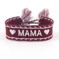 Close-up of woven burgundy friendship bracelet featuring white MAMA embroidery and tassels - MAMA-4