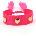 Pink woven fabric bracelet featuring polished gold heart studs and fringe tassels - Gold Heart Rivets / Bright Pink (H010)