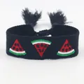 Handwoven black strap bracelet featuring red watermelon embroidery and tassel details - Watermelon Embroidery / Black
