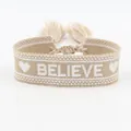Adjustable beige woven bracelet with white BELIEVE embroidery and tassel fringe details - Believe / Khaki