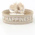 Woven tassel friendship bracelet with white HAPPINESS embroidery on light brown cotton - Happiness