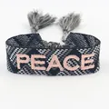 Bohemian woven friendship bracelet with PEACE embroidery and black white plaid tassels - PEACE Letters / Grey and White Plaid