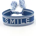 Adjustable blue and white woven strap bracelet with SMILE lettering and tassel ties - Silver SMILE Style 2