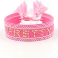 Pink woven wristband with gold PRETTY lettering and adjustable tassel closure - Gold PRETTY Style 2