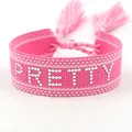 Adjustable pink woven wristband with white dotted PRETTY lettering and tassels - Silver PRETTY Style 2