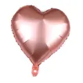 Detail view of the rose gold heart foil balloon showing smooth metallic texture and air valve - 18-inch Metallic Champagne Gold