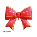 Macro detail of large red bow balloon with gold trim and 98x75cm size spec - Red with Gold Edge and Stars