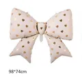 Cream bow-shaped foil balloon with gold heart print for parties, 98*74cm size - White with Gold Hearts