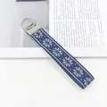 Cordon porte-clés tissé de style ethnique avec motif flocon bleu et anneau argenté - Motif Géométrique A
