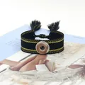 Pulsera étnica trenzada negra con hilo dorado, botón de presión plateado y borlas suaves - Negro Dorado (7#)