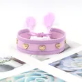 Detail of purple hand-woven friendship bracelet with golden heart rivets and tassels - Gold Heart Rivets / Purple Mixed (H-G-021)
