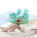 Pulsera trenzada turquesa con borlas, botón de presión plateado e hilo dorado - Cyan (9#)