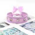Bracelet tissé avec rivets coeur en argent et pompons violets de style ethnique - Violet