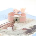Pulsera Noosa tejida a rayas rosas y blancas con botón a presión y borla de flecos - Rayado Rosa Blanco (17#)