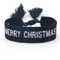 Detail of black woven bracelet with MERRY CHRISTMAS embroidery and fringe tassels - Merry Christmas 3