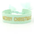 Detailed close-up of mint green woven bracelet with gold Merry Christmas embroidery - Merry Christmas 4