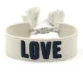 Close-up of 3D embroidered LOVE lettering and woven fringe details on friendship bracelet - Style 41 Navy Berry