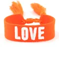 Close-up of orange braided bracelet with white 3D LOVE embroidery and tassel details - 31#