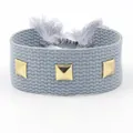 Bracelet tressé bleu-gris clair avec clous pyramide dorés et glands réglables - Bleu gris