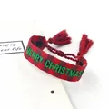 Detail of embroidered Merry Christmas woven bracelet with festive red tassels and adjustable cord - Merry Christmas 7