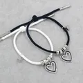 Matching magnetic couple bracelets with heart pendants and woven fiber ropes for lovers - Black and White Rope Heart