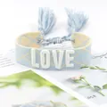 Adjustable light blue woven bracelet with white LOVE embroidery and fringe detail - 23#