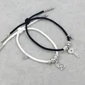 Bracelets de couple tressés avec pendentifs serrure et clé sertis de diamants brillants - Clé et Serrure en Corde Noire et Blanche