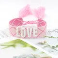 Pink woven LOVE bracelet with white embroidery, tassels and geometric diamond patterns - 25#