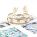 Handmade woven white bracelet with three golden heart rivets and adjustable tassels - Gold Heart Rivets / White and Gold (H-G-004)