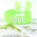 Neon green woven heart bracelet featuring white LOVE embroidery and tassel closure - Style 34 Pink Floral