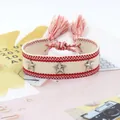 Pulsera tejida bohemia roja y blanca con remaches de estrellas y detalles de flecos - Rojo Blanco Rayado (59#)