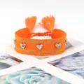 Bracelet tressé orange avec clous en forme de cœur argentés et pompons ethniques - Orange Gold Silk