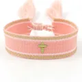 Pink woven friendship bracelet with golden cross embroidery and decorative tassels - Cross-2